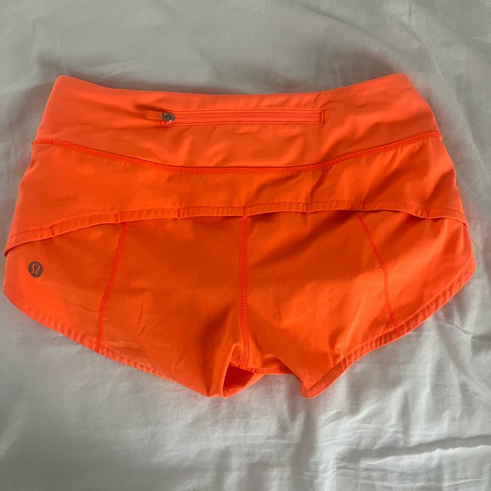 Bright orange Lululemon sped up shorts (2.5in) size 2!